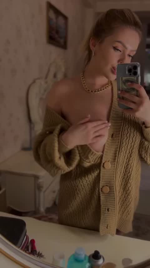 Mirror selfie she pulls her beige cardigan down showing one full soft breast while holding the phone Sub OF